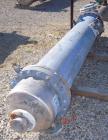 Used Atlas Shell And Tube Heat Exchanger, approximately 234 square feet, vertical. Carbon steel shell rated 100 psi at 300 deg.f., (163) 3/4