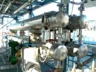 USED: Atlas four pass shell and tube heat exchanger, 561 square feet, horizontal. Hastelloy C276 shell rated FV and 150 psi at 400 deg F, (144) 3/4
