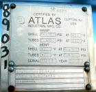 USED: Atlas four pass shell and tube heat exchanger, 561 square feet, horizontal. Hastelloy C276 shell rated FV and 150 psi at 400 deg F, (144) 3/4