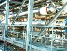 USED: Atlas four pass shell and tube heat exchanger, 561 square feet, horizontal. Hastelloy C276 shell rated FV and 150 psi at 400 deg F, (144) 3/4
