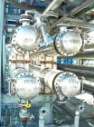 USED: Atlas four pass shell and tube heat exchanger, 561 square feet, horizontal. Hastelloy C276 shell rated FV and 150 psi at 400 deg F, (144) 3/4