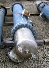 Used Atlas Shell and Tube Heat Exchanger, 167 square feet, vertical. Type BEM14-84.  Carbon steel shell rated 100 psi at 300 deg F, (122) 3/4