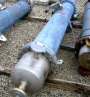 Used Atlas Shell and Tube Heat Exchanger, 167 square feet, vertical. Type BEM14-84.  Carbon steel shell rated 100 psi at 300 deg F, (122) 3/4