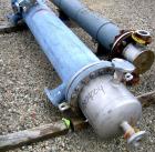 Used Atlas Shell and Tube Heat Exchanger, 167 square feet, vertical. Type BEM14-84.  Carbon steel shell rated 100 psi at 300 deg F, (122) 3/4
