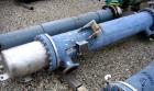 Used Atlas Shell and Tube Heat Exchanger, 167 square feet, vertical. Type BEM14-84.  Carbon steel shell rated 100 psi at 300 deg F, (122) 3/4