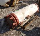 USED: Carbone Lorrain graphite heat exchanger, approximately 90 square feet. carbon steel shell and heads, model PBC13-4thu-1-6. Shell rated 100 psi at 250 deg F.Openings: heads (2) 5-1/2