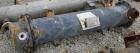Used Cosmos Single Pass Shell And Tube Heat Exchanger, 123 square feet, vertical. Carbon steel shell rated 150 psi/FV at 400 deg F, (106) 3/4