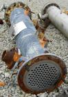 Used Cosmos Single Pass Shell And Tube Heat Exchanger, 123 square feet, vertical. Carbon steel shell rated 150 psi/FV at 400 deg F, (106) 3/4