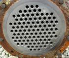 Used Cosmos Single Pass Shell And Tube Heat Exchanger, 123 square feet, vertical. Carbon steel shell rated 150 psi/FV at 400 deg F, (106) 3/4
