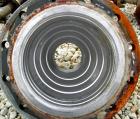 Used Cosmos Single Pass Shell And Tube Heat Exchanger, 123 square feet, vertical. Carbon steel shell rated 150 psi/FV at 400 deg F, (106) 3/4
