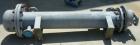 Unused- Cosmos Minerals multiple pass shell and tube heat exchanger, 34.5 square feet, horizontal. Carbon steel shell rated 90 psi at 320 deg F, (32) 3/4