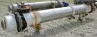 Used Futura Titanium Corporation Single Pass Shell and Tube Heat Exchanger, 319 Square Feet, Horizontal. Type BEM 14-2-144. 316L stainless steel shell rated 60 psi/FV at 350 deg F. (140) 3/4