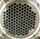 Used: Pfizer Monel shell and tube heat exchanger, approximately 241 square feet, horizontal. Carbon steel shell rated 150 psi at -55 to 350 deg F. (126) 3/4