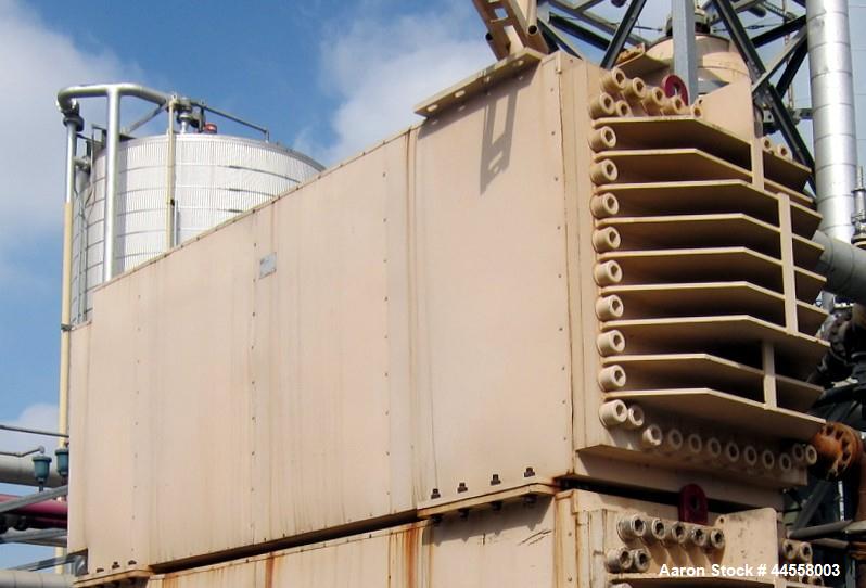 Used DDI Heat Recovery Heat Exchanger, Model DDI-3X5.75X 7 X 3.8 X 8 X 11X.875M, Rated 720 psi.  Utilized as a preheater to preheat raw sludge.  Carbon steel construction. Square channel.