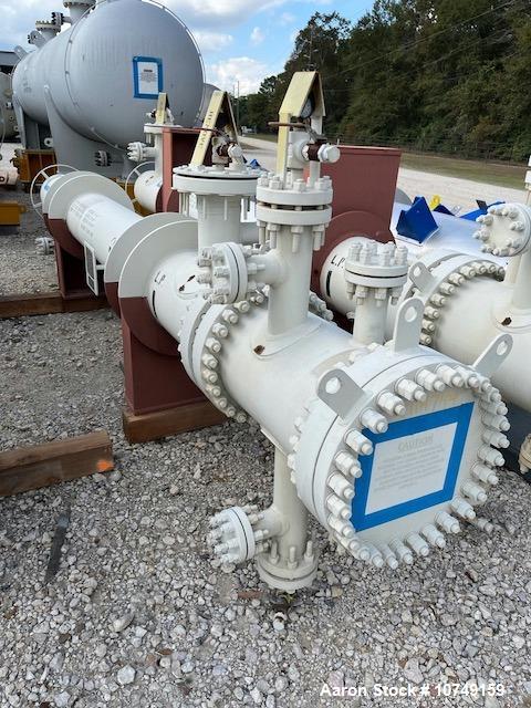 Used Fabsco Shell and Tube Heat Exchanger, 299 Square Foot. Carbon steel tubes rated 405 psi at 32 to 330 degrees F. 13' Tube length. Carbon steel head. Carbon steel shell rated 405 psi at 5 to 300 d...