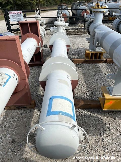 Used Fabsco Shell and Tube Heat Exchanger, 299 Square Foot. Carbon steel tubes rated 405 psi at 32 to 330 degrees F. 13' Tube length. Carbon steel head. Carbon steel shell rated 405 psi at 5 to 300 d...