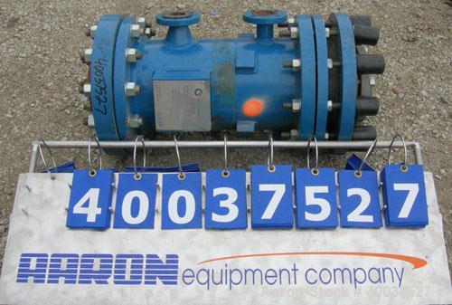 Used SGL Carbon Group Cylidrical Block Graphite Heat Exchanger. Approximately 25 square feet, vertical. Model CK2. Service and process sides each rated 100 psi at 356 deg F. Openings: shell (2) 2", t...