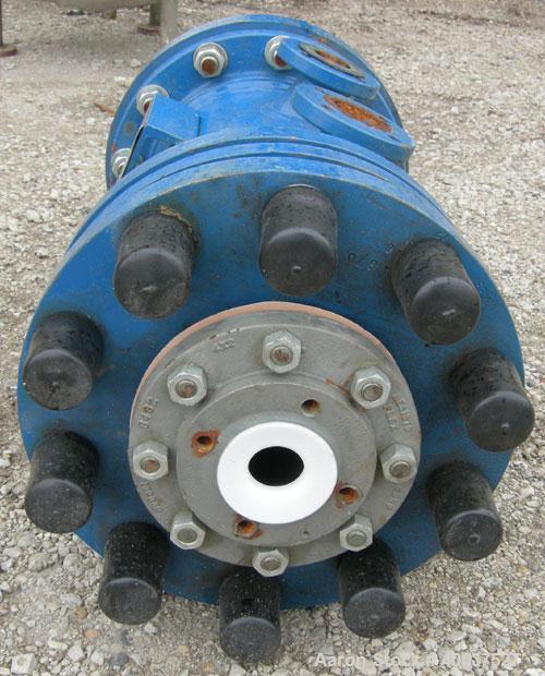 Used SGL Carbon Group Cylidrical Block Graphite Heat Exchanger. Approximately 25 square feet, vertical. Model CK2. Service and process sides each rated 100 psi at 356 deg F. Openings: shell (2) 2", t...