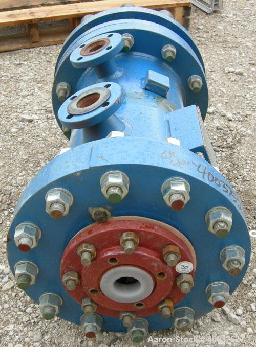 Used SGL Carbon Group Cylidrical Block Graphite Heat Exchanger. Approximately 25 square feet, vertical. Model CK2. Service and process sides each rated 100 psi at 356 deg F. Openings: shell (2) 2", t...