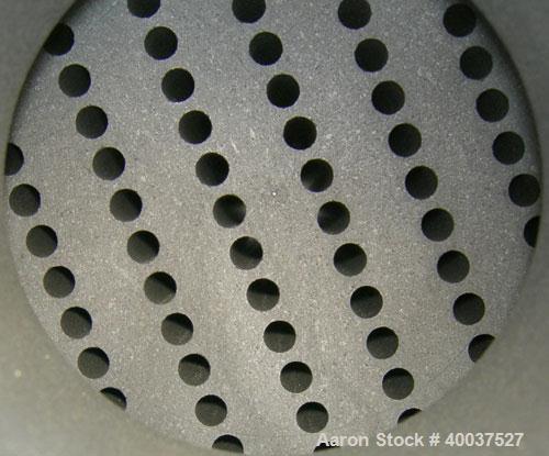 Used SGL Carbon Group Cylidrical Block Graphite Heat Exchanger. Approximately 25 square feet, vertical. Model CK2. Service and process sides each rated 100 psi at 356 deg F. Openings: shell (2) 2", t...