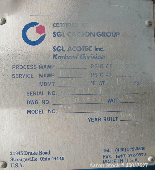 Used SGL Carbon Group Cylidrical Block Graphite Heat Exchanger. Approximately 25 square feet, vertical. Model CK2. Service and process sides each rated 100 psi at 356 deg F. Openings: shell (2) 2", t...
