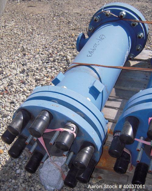 Used SGL Carbon Group Cylidrical Block Graphite Heat Exchanger. Approximately 25 square feet, vertical, model CK2. Service and process sides each rated 100 psi at 356 deg F. Openings: shell (2) 2", t...
