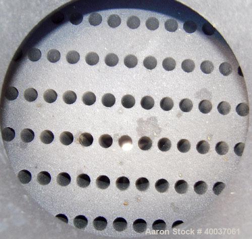 Used SGL Carbon Group Cylidrical Block Graphite Heat Exchanger. Approximately 25 square feet, vertical, model CK2. Service and process sides each rated 100 psi at 356 deg F. Openings: shell (2) 2", t...