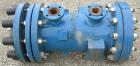 Used SGL Carbon Group Cylidrical Block Graphite Heat Exchanger. Approximately 25 square feet, vertical. Model CK2. Service and process sides each rated 100 psi at 356 deg F. Openings: shell (2) 2