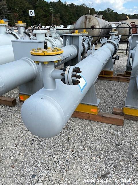 Used Wuxi Chemical Equipment Horizontal 333 sq. ft. Shell and Tube Heat Exchanger. Duplex 2205 stainless steel tubes rated 288.3 psi at 32 to 330 degrees F, 16' 7'' tube length. Duplex 2205 shell rat...