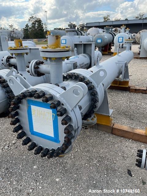 Used Wuxi Chemical Equipment Horizontal 333 sq. ft. Shell and Tube Heat Exchanger. Duplex 2205 stainless steel tubes rated 288.3 psi at 32 to 330 degrees F, 16' 7'' tube length. Duplex 2205 shell rat...