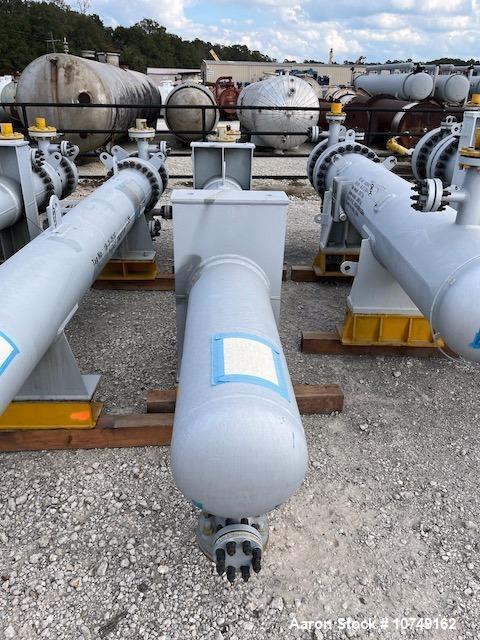 Used Wuxi Chemical Equipment 333 Square Foot Horizontal Shell and Tube Heat Exchanger. Duplex 2205 stainless steel tubes rated 288.3 psi at 32 to 330 degrees F, 16' 7'' Tube length. Carbon steel head...