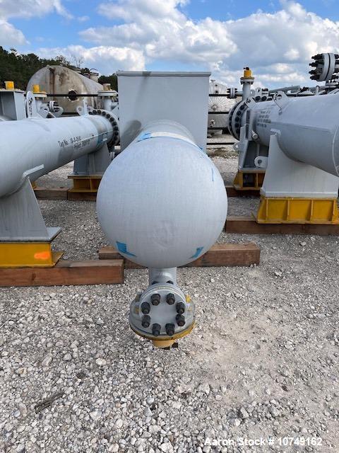 Used Wuxi Chemical Equipment 333 Square Foot Horizontal Shell and Tube Heat Exchanger. Duplex 2205 stainless steel tubes rated 288.3 psi at 32 to 330 degrees F, 16' 7'' Tube length. Carbon steel head...