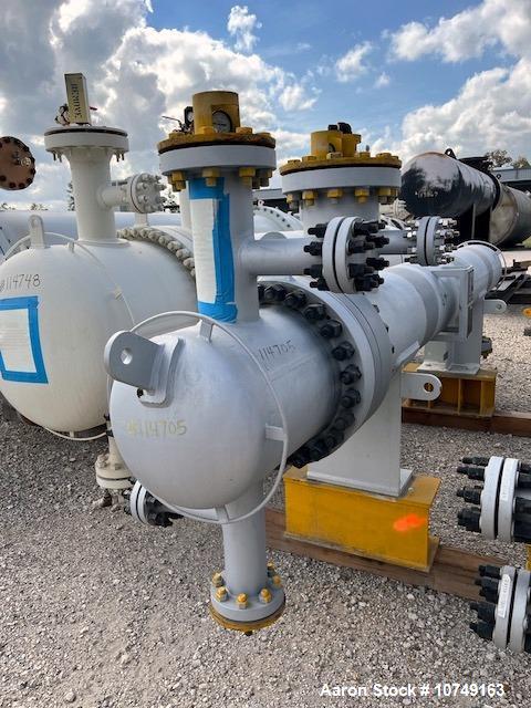 Used Wuxi Chemical Equipment Horizontal 234 Square Foot Shell and Tube Heat Exchanger. Duplex 2205 stainless steel tubes rated 532 psi at 32 to 430 degrees F, 9' Tube length, 130 tube holes. Carbon s...