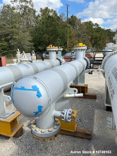 Used Wuxi Chemical Equipment Horizontal 234 Square Foot Shell and Tube Heat Exchanger. Duplex 2205 stainless steel tubes rated 532 psi at 32 to 430 degrees F, 9' Tube length, 130 tube holes. Carbon s...