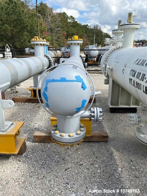 Used Wuxi Chemical Equipment Horizontal 234 Square Foot Shell and Tube Heat Exchanger. Duplex 2205 stainless steel tubes rated 532 psi at 32 to 430 degrees F, 9' Tube length, 130 tube holes. Carbon s...