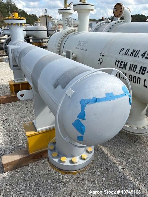 Used Wuxi Chemical Equipment Horizontal 234 Square Foot Shell and Tube Heat Exchanger. Duplex 2205 stainless steel tubes rated 532 psi at 32 to 430 degrees F, 9' Tube length, 130 tube holes. Carbon s...
