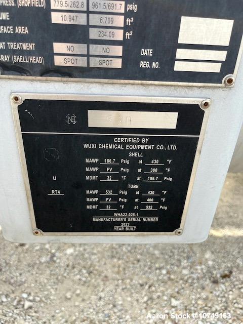 Used Wuxi Chemical Equipment Horizontal 234 Square Foot Shell and Tube Heat Exchanger. Duplex 2205 stainless steel tubes rated 532 psi at 32 to 430 degrees F, 9' Tube length, 130 tube holes. Carbon s...