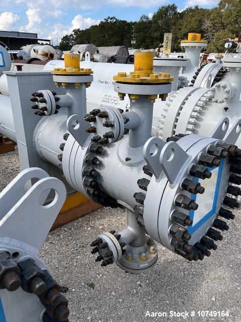 Used Wuxi Chemical Equipment 333 Square Foot Shell and Tube Heat Exchanger, Horizontal. Duplex 2205 stainless steel tubes rated 288.3 psi at 32 to 330 degrees F, 16' 7'' Tube length. 15'' Shell diame...