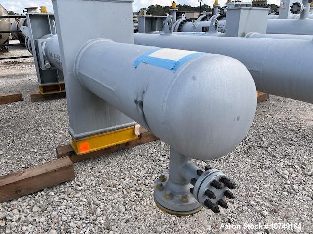 Used Wuxi Chemical Equipment 333 Square Foot Shell and Tube Heat Exchanger, Horizontal. Duplex 2205 stainless steel tubes rated 288.3 psi at 32 to 330 degrees F, 16' 7'' Tube length. 15'' Shell diame...