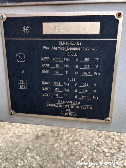 Used Wuxi Chemical Equipment 333 Square Foot Shell and Tube Heat Exchanger, Horizontal. Duplex 2205 stainless steel tubes rated 288.3 psi at 32 to 330 degrees F, 16' 7'' Tube length. 15'' Shell diame...