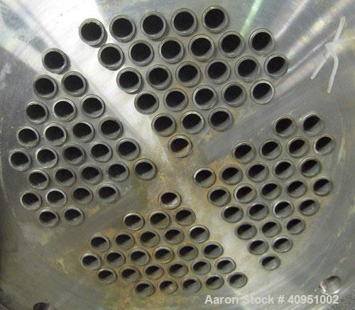 Used KAM Thermal 4 Pass Shell and Tube Heat Exchanger, Approximately 122 Square Feet, Horizontal. 316 stainless steel shell rated 150 psi/fv at 250 deg F. (104) 3/4" diameter x 71 1/2" long 316 stain...