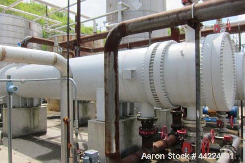 Used-Heat Exchanger, 4280 Square Feet, 4 pass shell and tube, horizontal.  Carbon steel shell rated 75 psi at 300 deg F.  (1...