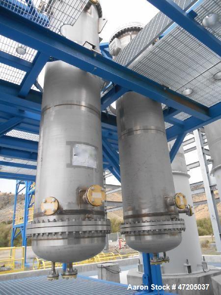 Unused- Shell and Tube Heat Exchanger, 265 Square Foot, Vertical. 304L Stainless steel shell rated 150 psi/FV at -30 to 300 degrees F. (76) 1-1/2" Diameter x 10' long 304L stainless steel tubes rated...