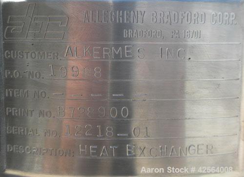 Used Allegheny Bradford Shell and Tube Heat Exchanger, 20 square feet, 316 stainless steel, vertical. (26) 7/8" Diameter x 39-1/2" long tubes. 5/8" Inlet/outlet shell. No heads. Mounted on 3 stainles...