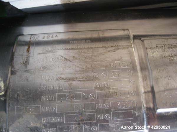 Used Allegheny Bradford shell and tube heat exchanger, 20 sq ft U tube, 316L stainless steel tubes, tube sheet and bonnet (56) 3/8" diameter x 4' long tubes rated 150 psi at 350 f, 304L stainless ste...