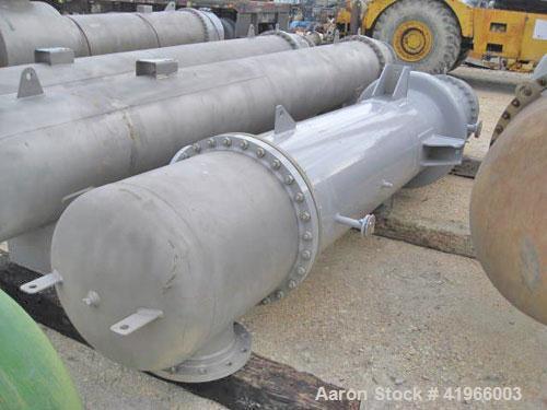 Unused- Atlas Industrial Single Pass Shell and Tube Heat Exchanger, 1274 square feet, vertical, type BEM 26-144. Carbon steel shell rated FV/150 psi at -20 to 400 deg F. (552) 3/4" diameter x 12’ lon...