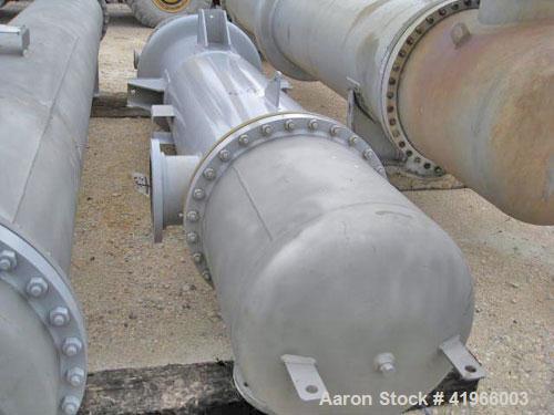 Unused- Atlas Industrial Single Pass Shell and Tube Heat Exchanger, 1274 square feet, vertical, type BEM 26-144. Carbon steel shell rated FV/150 psi at -20 to 400 deg F. (552) 3/4" diameter x 12’ lon...