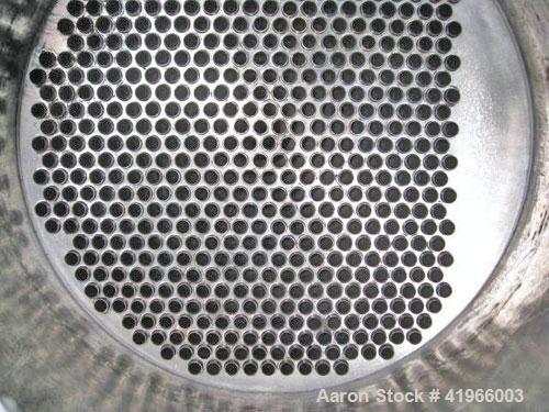Unused- Atlas Industrial Single Pass Shell and Tube Heat Exchanger, 1274 square feet, vertical, type BEM 26-144. Carbon steel shell rated FV/150 psi at -20 to 400 deg F. (552) 3/4" diameter x 12’ lon...