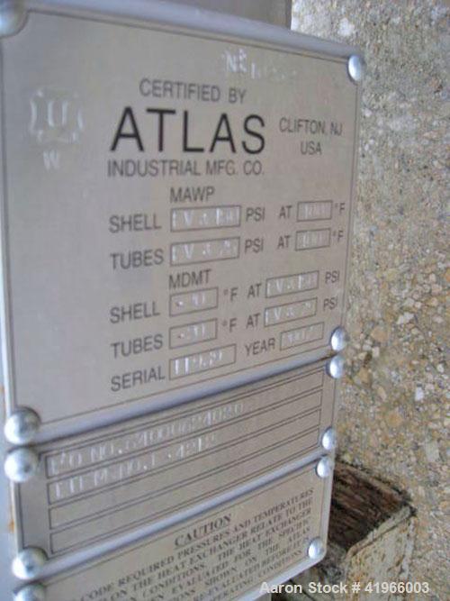 Unused- Atlas Industrial Single Pass Shell and Tube Heat Exchanger, 1274 square feet, vertical, type BEM 26-144. Carbon steel shell rated FV/150 psi at -20 to 400 deg F. (552) 3/4" diameter x 12’ lon...