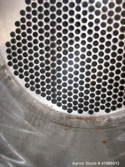 Unused- Atlas Industrial Single Pass Shell and Tube Heat Exchanger, 1274 square feet, vertical, type BEM 26-144. Carbon steel shell rated FV/150 psi at -20 to 400 deg F. (552) 3/4" diameter x 12’ lon...